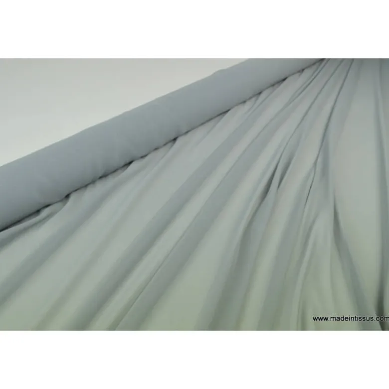 Tissu Mousseline fluide polyester gris .