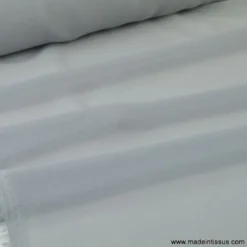 Tissu Mousseline fluide polyester gris .