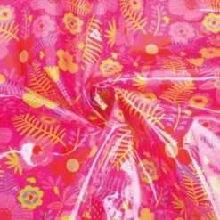 Tissu plastifié imprimé fleurs sur fond fuchsia