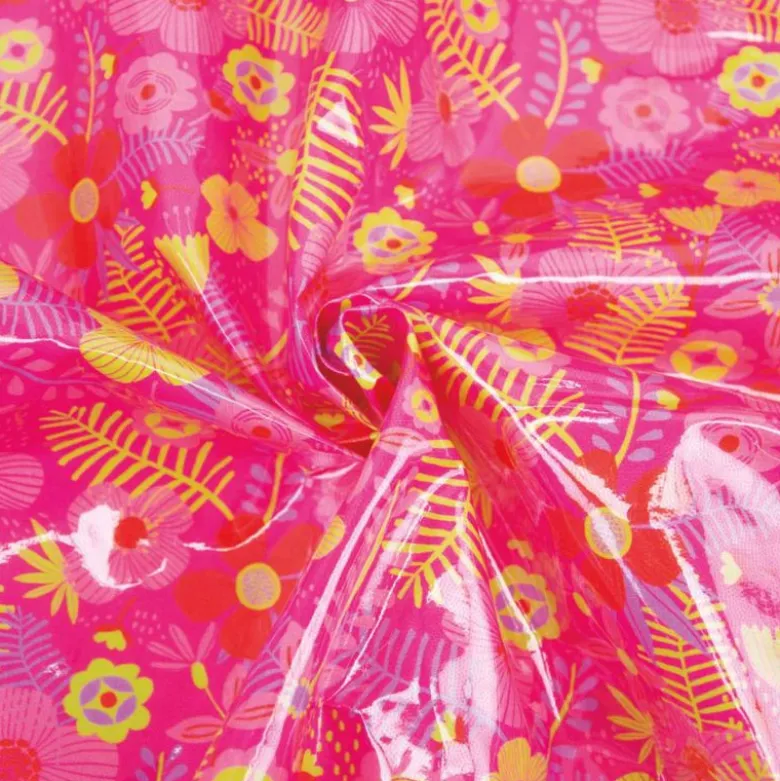 Tissu plastifié imprimé fleurs sur fond fuchsia