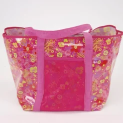 Tissu plastifié imprimé fleurs sur fond fuchsia