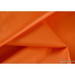 Tissu polyester orange déperlant pour parapluie .