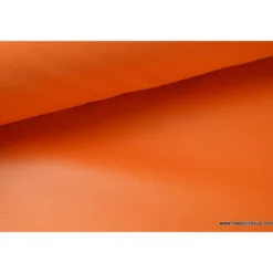 Tissu polyester orange déperlant pour parapluie .
