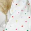 Tissu popeline de coton brodée coeurs multicouleurs