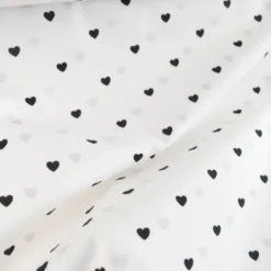Tissu popeline de coton motif coeurs noirs fond blanc