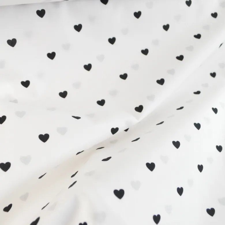 Tissu popeline de coton motif coeurs noirs fond blanc
