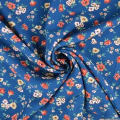Tissu popeline de viscose Sylore - motif fleurs marsala fond bleu