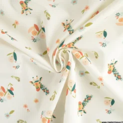 Tissu popeline motif girafes et fleurs roses fond bleu - Oeko tex