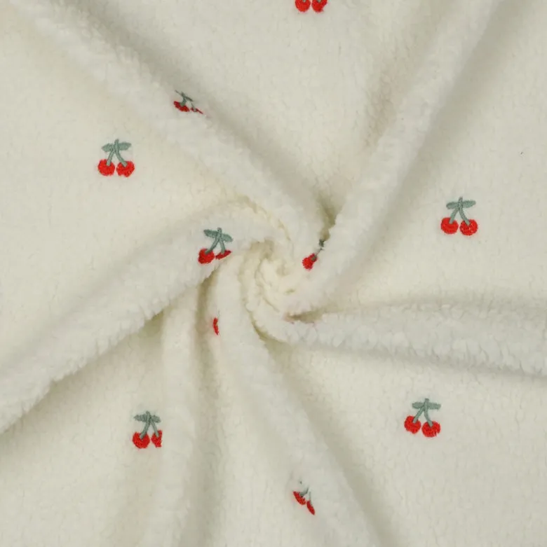 Tissu Sherpa brodée motif cerises fond écru