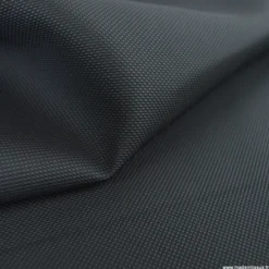 Tissu simili cuir pointillé noir pour sellerie moto.