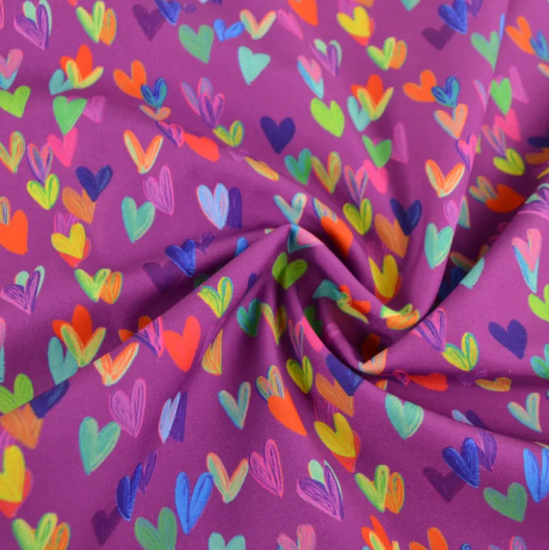Tissu softshell motif cœurs multicolores fond violet rose