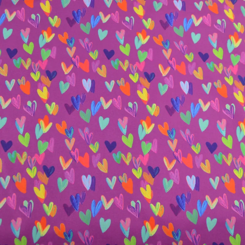 Tissu softshell motif cœurs multicolores fond violet rose