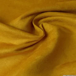Tissu suédine ameublement habillement moutarde.