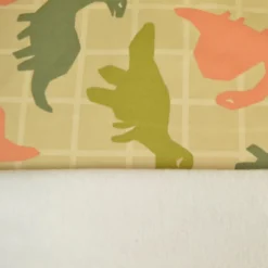 Tissu Sweat French terry motif dinosaures fond amande - OEKO TEX