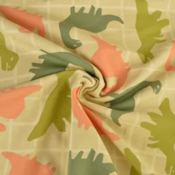 Tissu Sweat French terry motif dinosaures fond amande - OEKO TEX