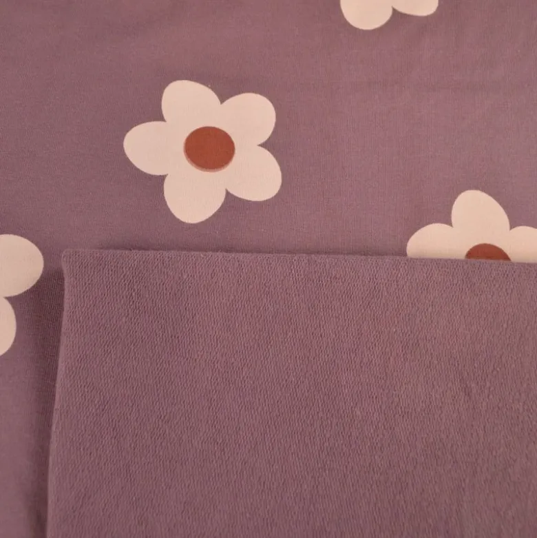 Tissu Sweat French terry motif fleurs fond parme - OEKO TEX