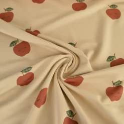 Tissu Sweat French terry motif pommes fond beige - OEKO TEX