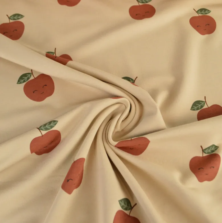 Tissu Sweat French terry motif pommes fond beige - OEKO TEX