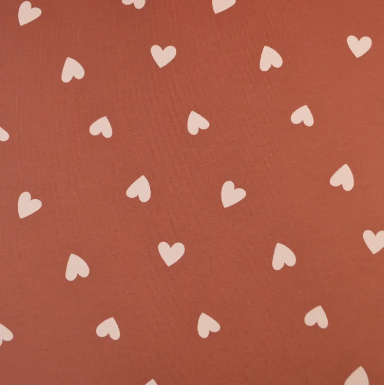 Tissu Sweat French terry motif coeurs fond vieux rose - OEKO TEX