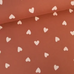 Tissu Sweat French terry motif coeurs fond vieux rose - OEKO TEX