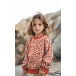 Tissu Sweat gratté motif Léopard orange fond écru