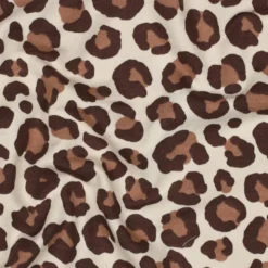 Tissu Sweat gratté motif Léopard caramel fond écru