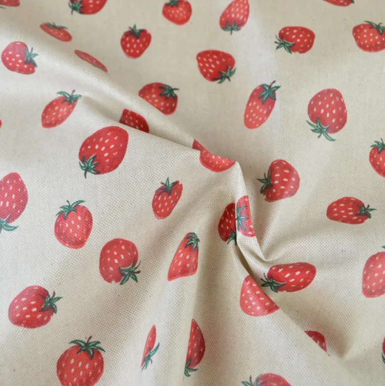 Tissu toile enduite aspect lin motif fraises