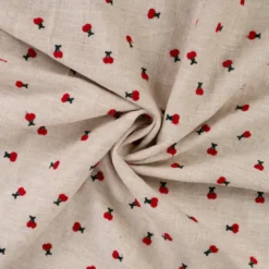 Tissu viscose lin brodé cerises rouges - fond sable