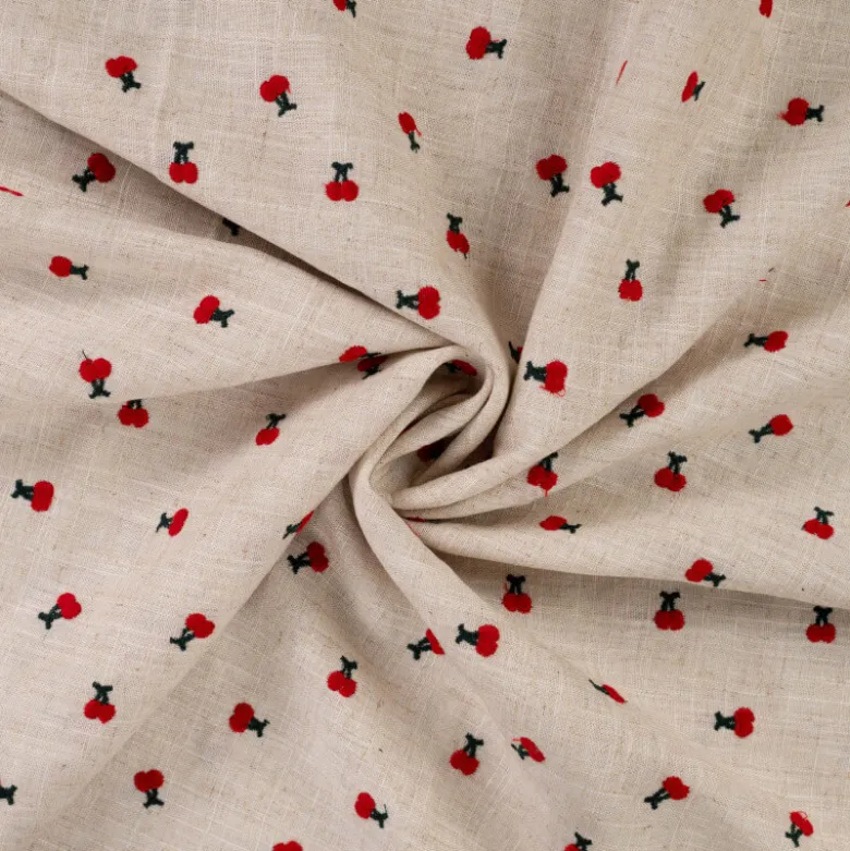 Tissu viscose lin brodé cerises rouges - fond sable