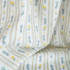 Voile plumetis rayures et citrons fond écru