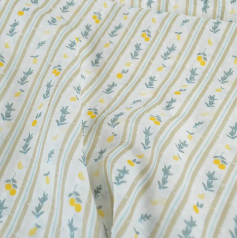 Voile plumetis rayures et citrons fond écru